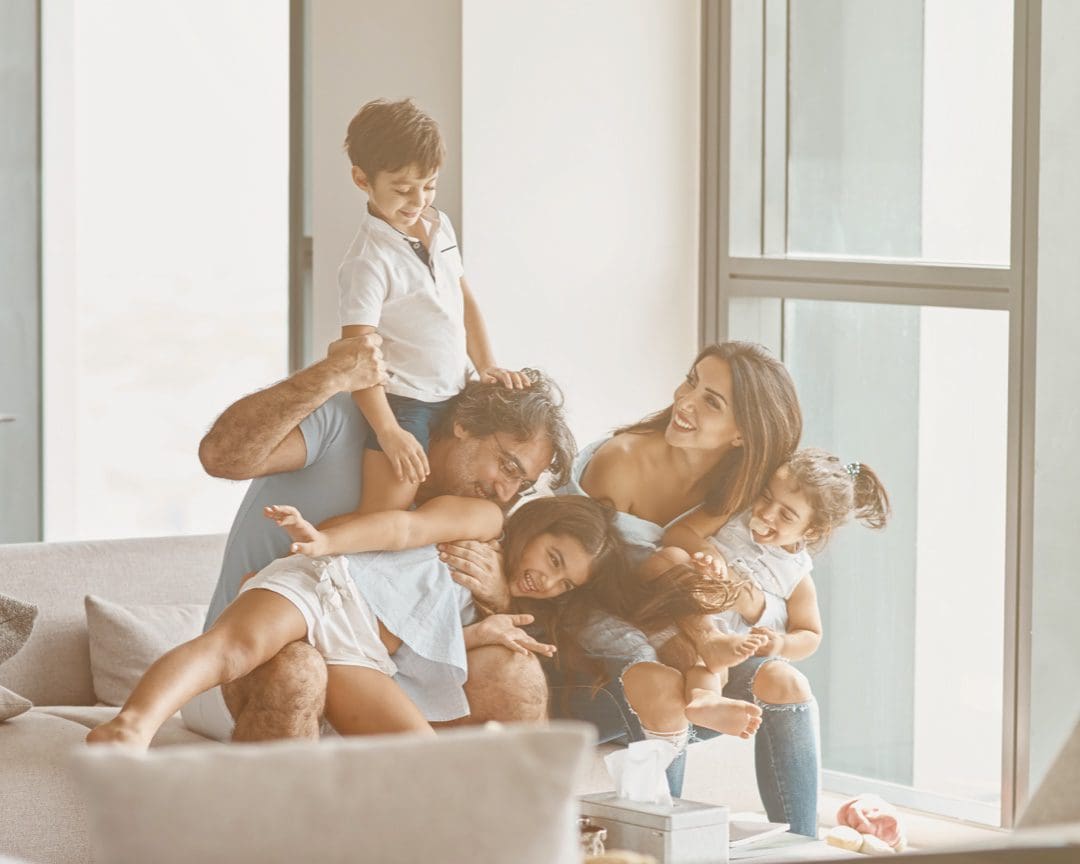 Family plays in their newly purchased home.