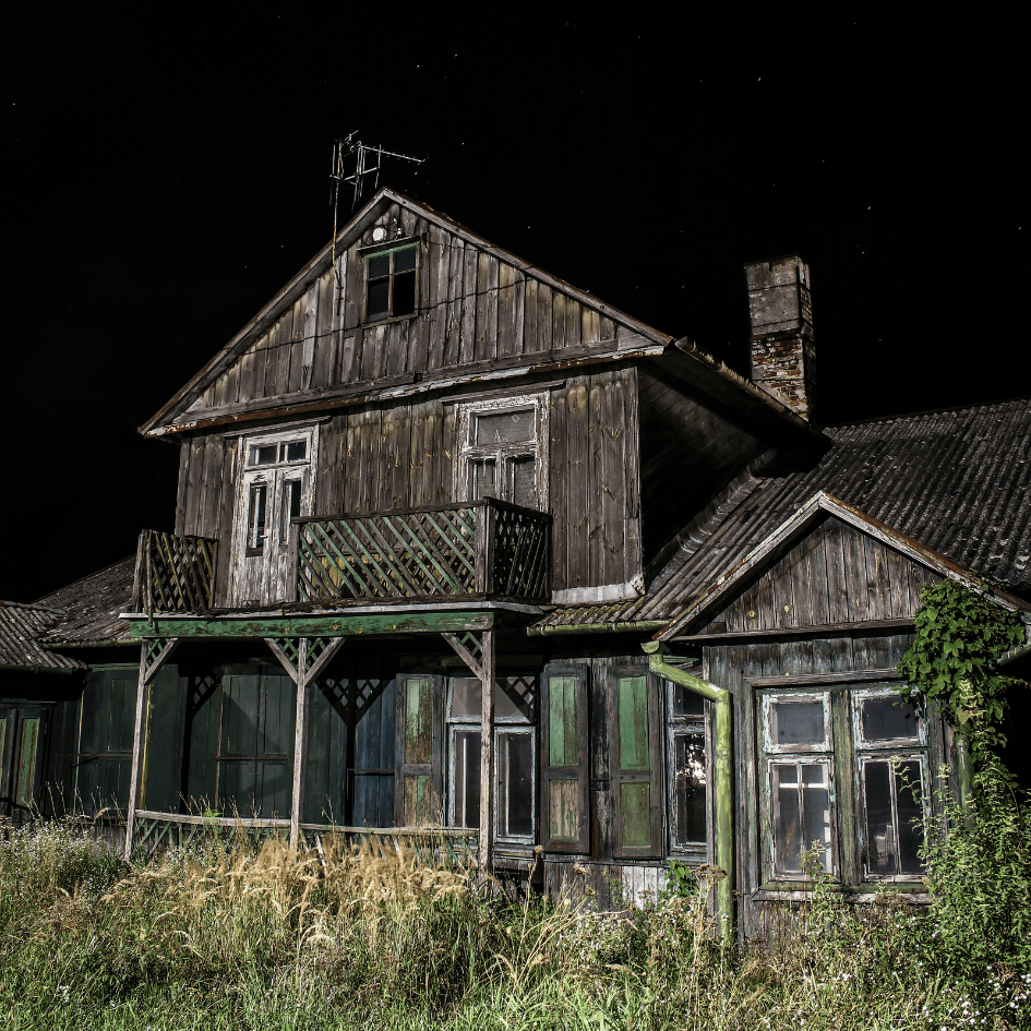 Rundown, haunted house in the dark.